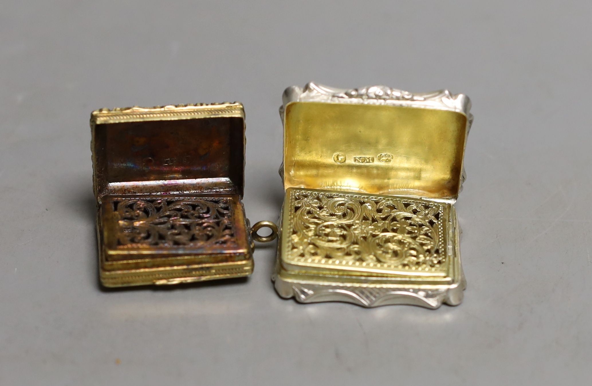 A George IV engine turned silver gilt vinaigrette, by Thomas Parker, Birmingham, with later bale,(date letter illegible), 30mm and a later vinaigrette by Nathaniel Mills, Birmingham, 1846, 36mm.